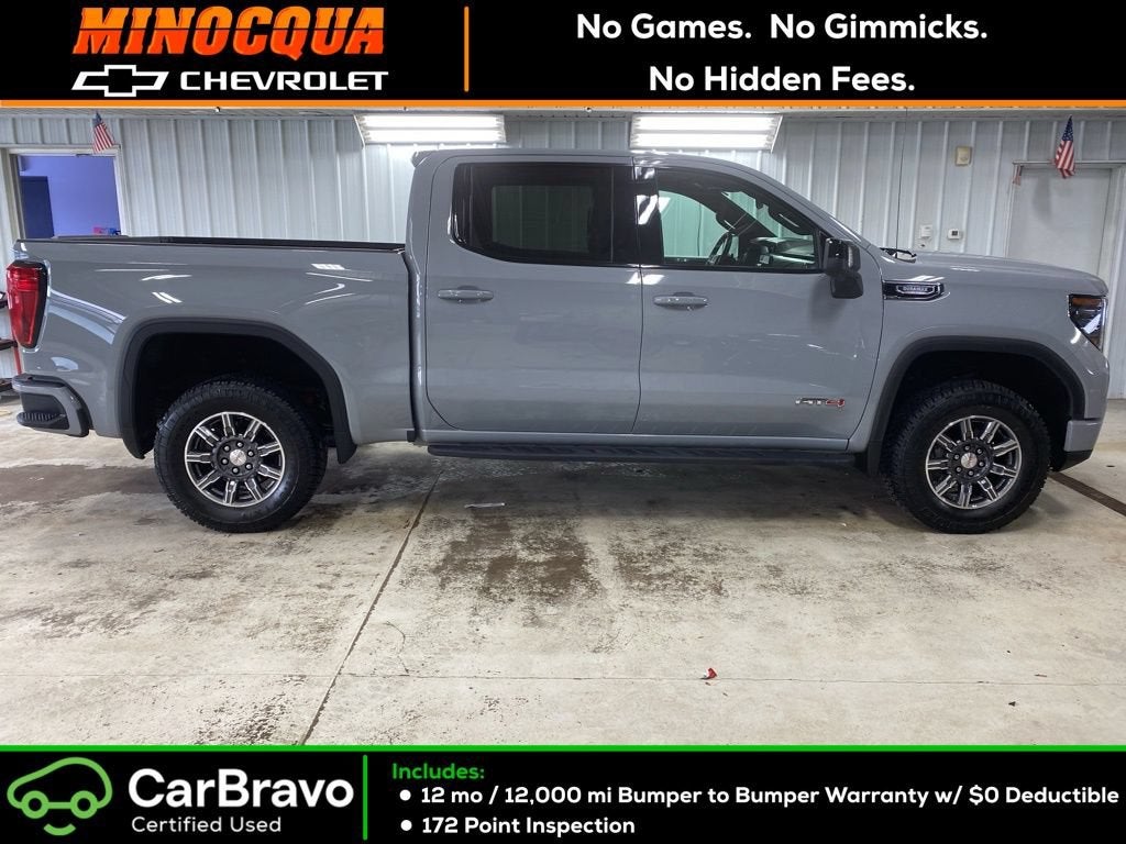 2024 GMC Sierra 1500 AT4 in Thunderstorm Gray — front three-quarter view